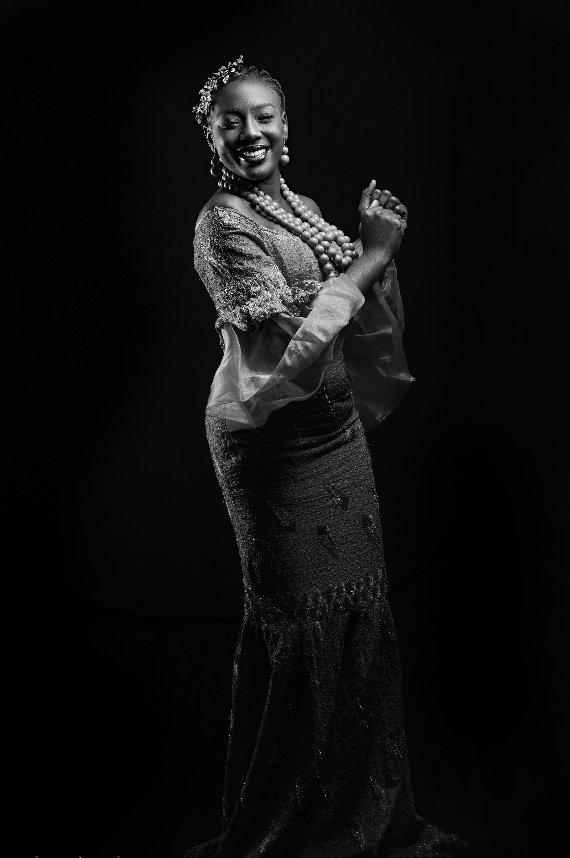 A woman in a dress poses for a black and white photo · Free Stock Photo