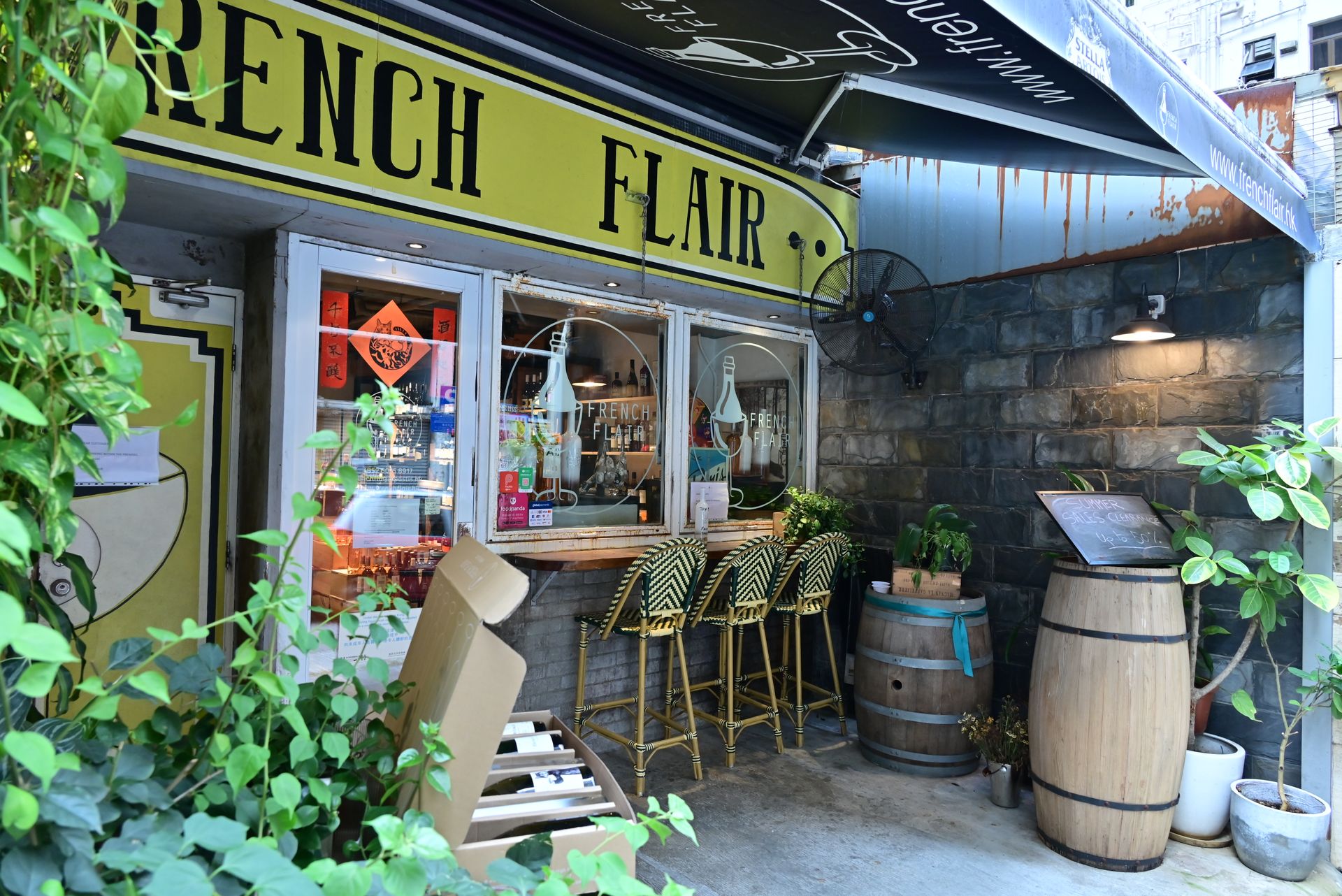 Explore a quaint outdoor cafe with French flair, perfect for urban dining experiences.