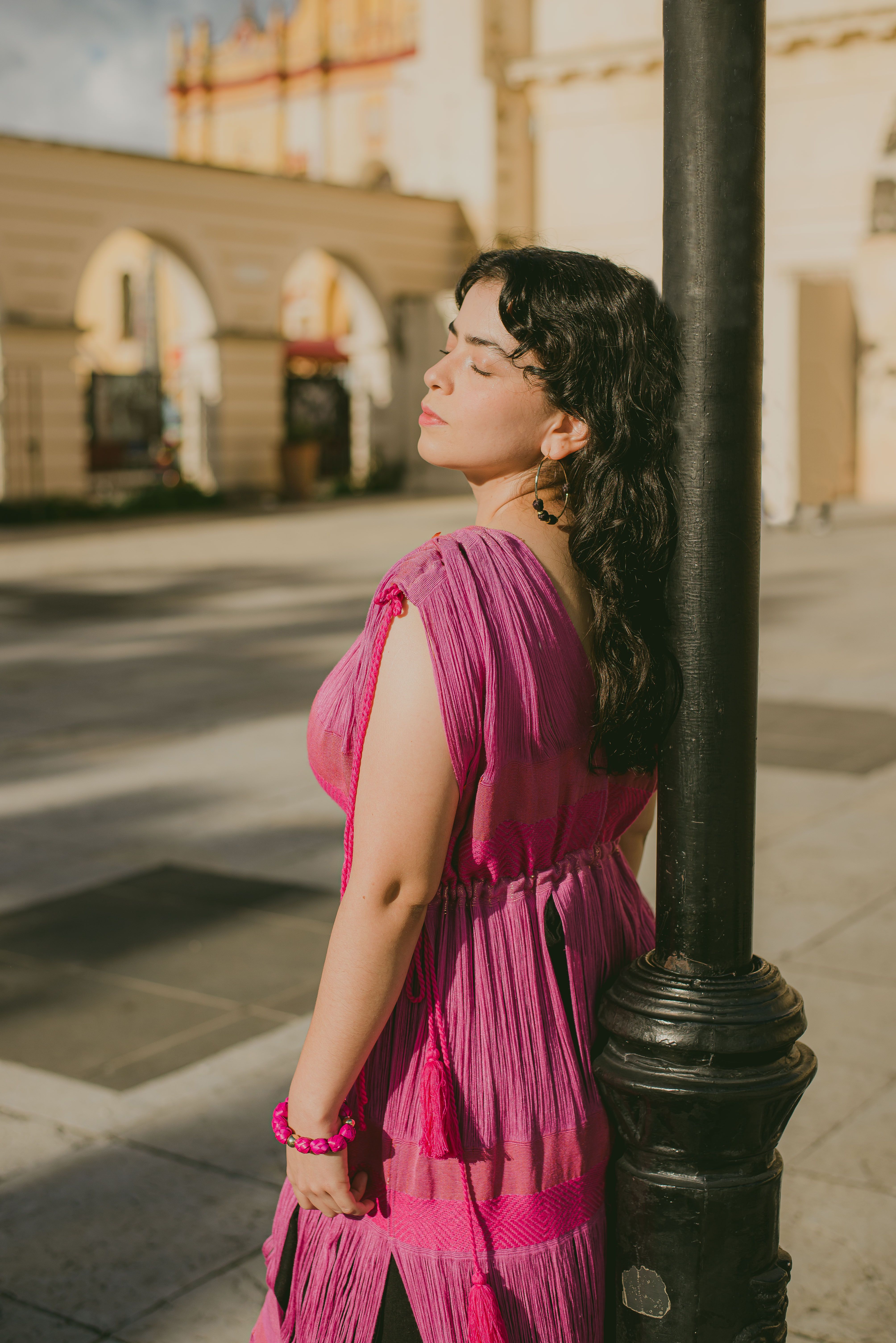 Woman in Pink Dress Leaning on Lamppost · Free Stock Photo