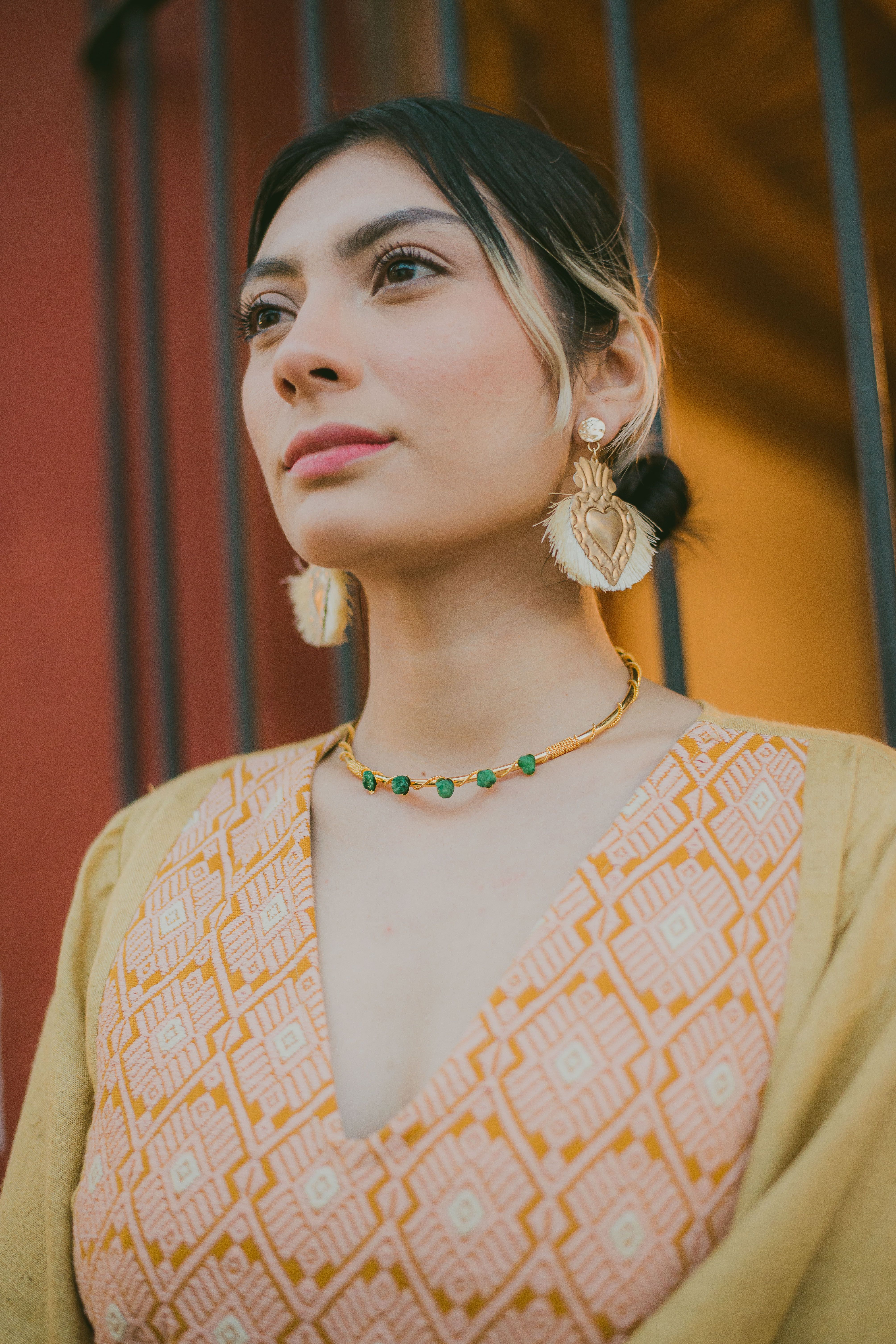 Elegant portrait of a woman with jewelry, vibrant fashion, San Cristóbal de las Casas.