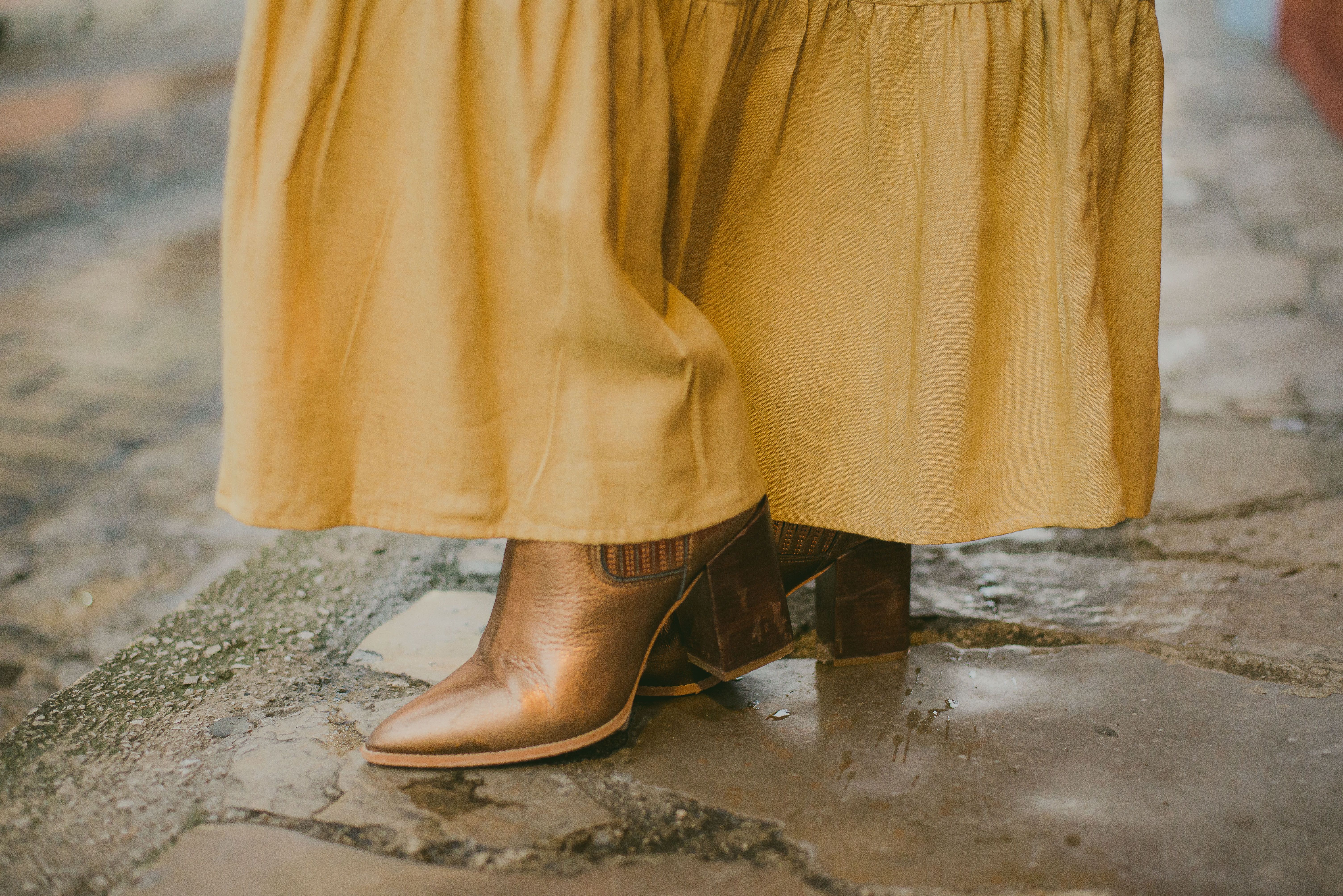Women Cowboy Boots in Sunflowers · Free Stock Photo