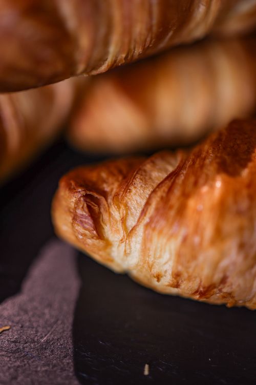 Free Delicious homemade croissants with a golden crust, ideal for breakfast. Stock Photo