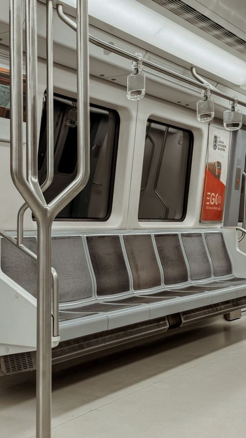 Free Spacious, clean interior of an empty modern subway train with steel design. Stock Photo