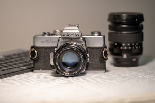 Free Close-up of a classic Minolta SR-T 505 film camera, highlighting its vintage design and lens. Stock Photo
