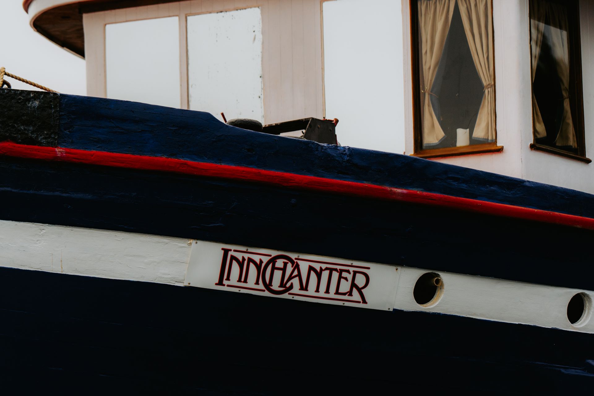 A boat with a red and white paint job