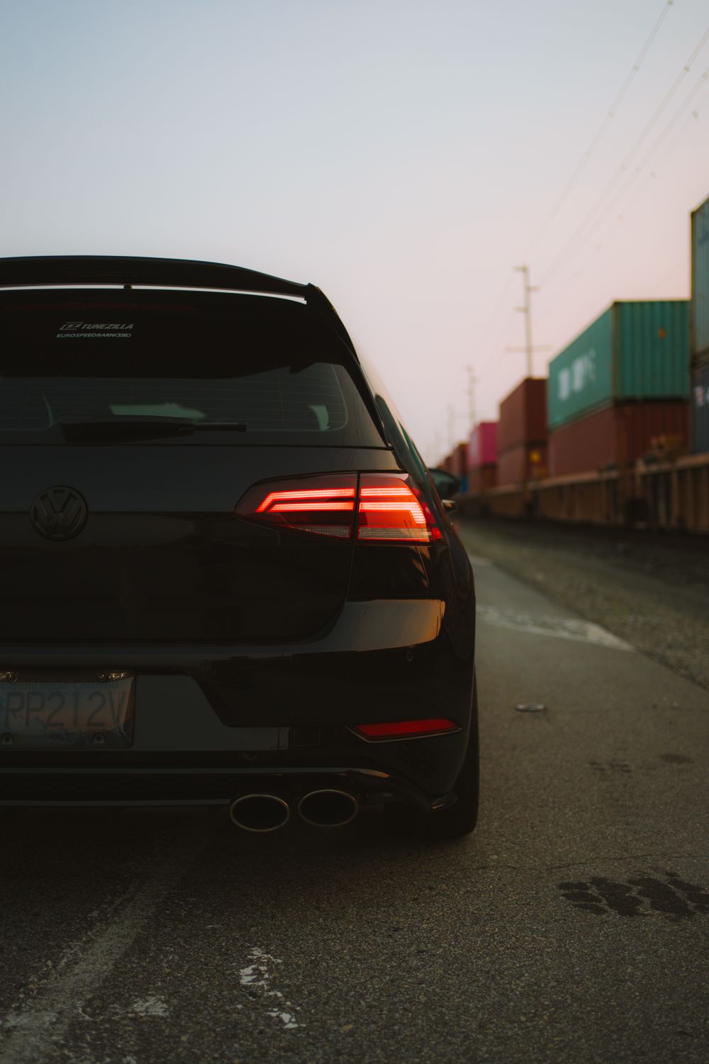 Latestkammback Car Rear A black car with a rear end view on a road · Free Stock Photo