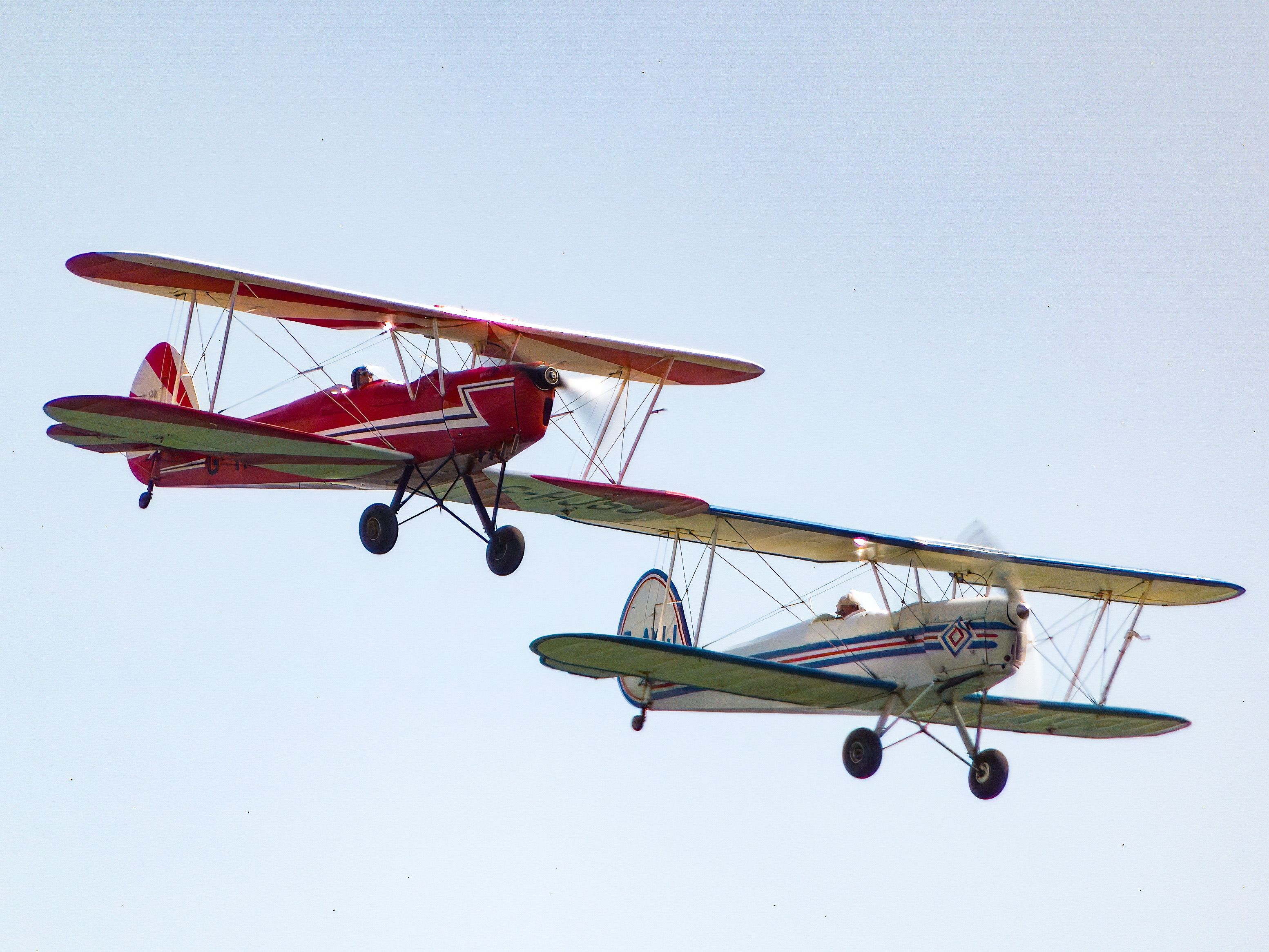 Two small airplanes flying in the sky · Free Stock Photo