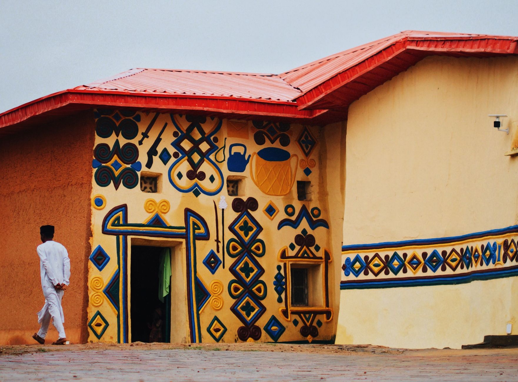 Vibrant traditional architecture with geometric patterns in Zaria, Nigeria.