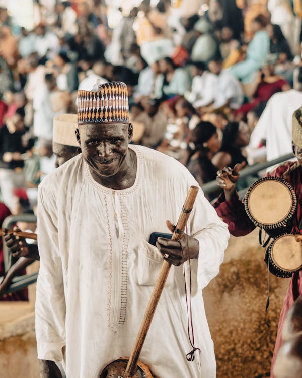 men in a traditional band playing local instruments · Free Stock Photo