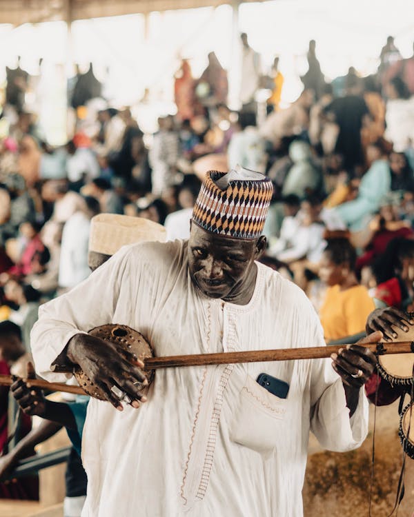 men in a traditional band playing local instruments · Free Stock Photo