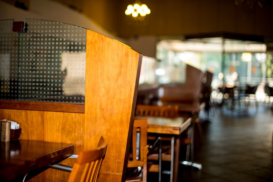 Warm, inviting restaurant interior featuring wooden tables and chairs. Perfect for dining settings.