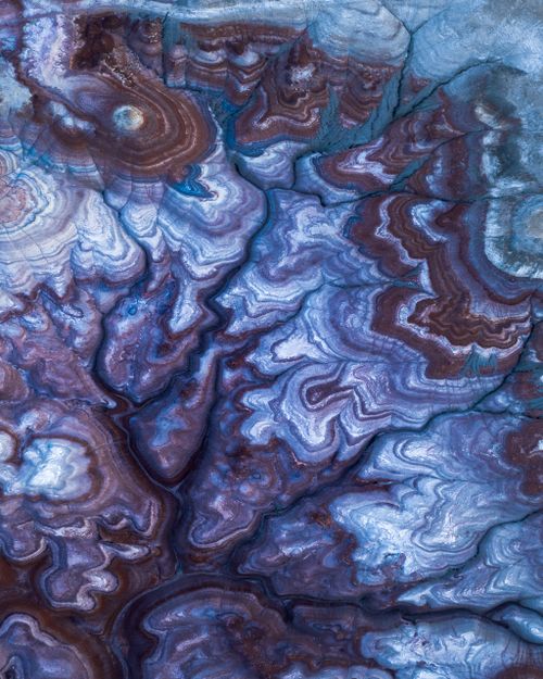 Free Close-up of swirling abstract patterns in blue and brown hues, resembling natural geodes. Stock Photo