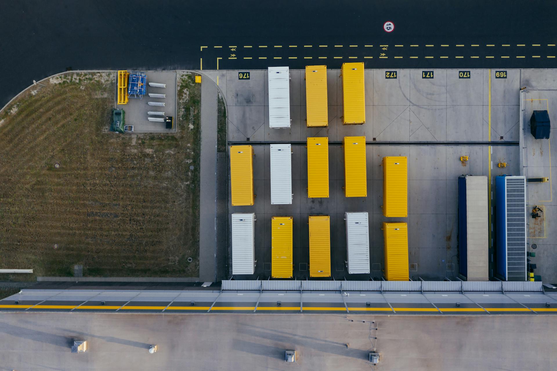 Aerial shot of colorful cargo containers at a warehouse in Poznań, Poland.