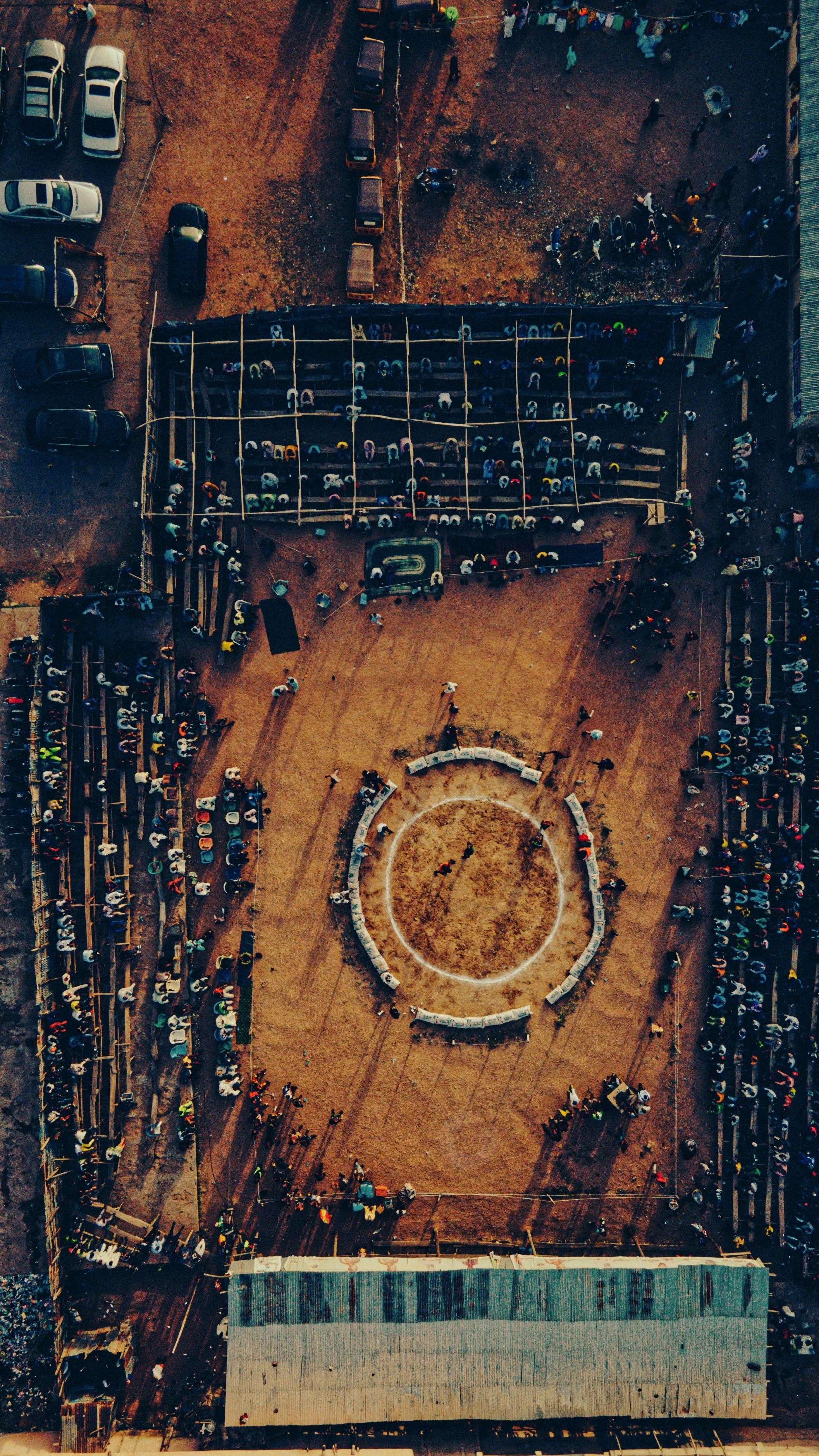 Aerial photograph capturing a vibrant market event in Kano, Nigeria from above, highlighting cultural dynamics.