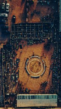 Aerial photograph capturing a vibrant market event in Kano, Nigeria from above, highlighting cultural dynamics.