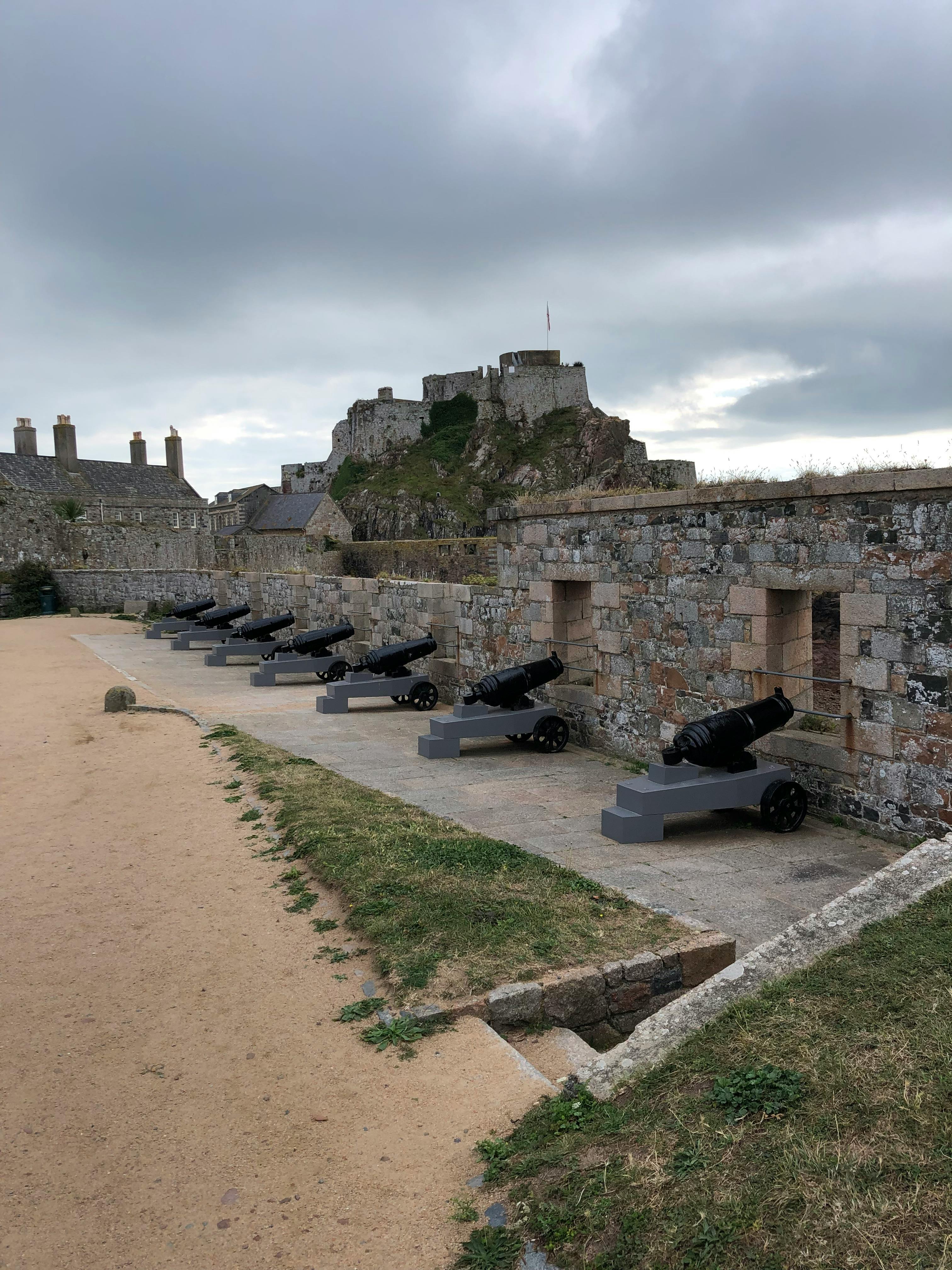 Free Cannons on the beach at st mary's castle Stock Photo