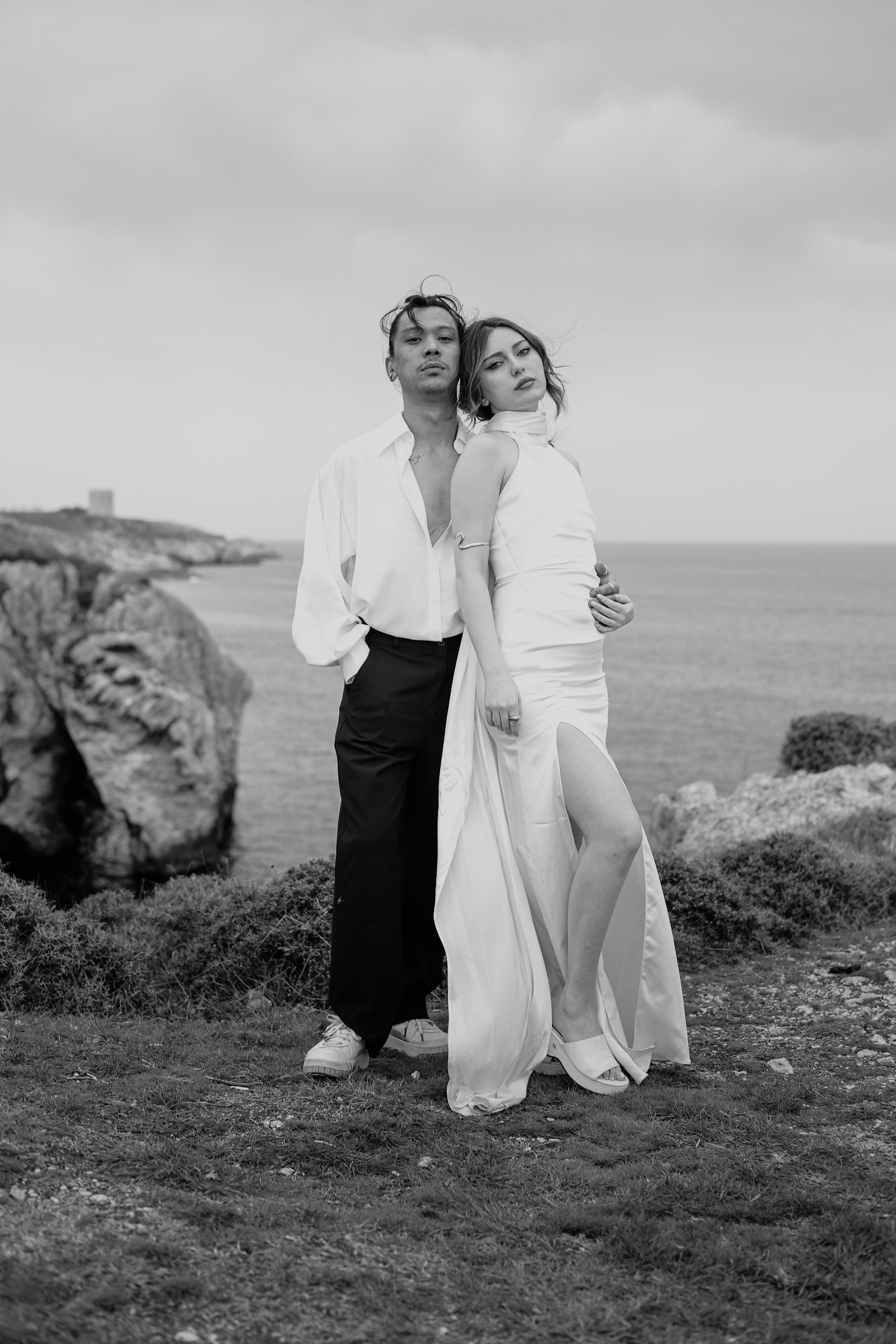 A black and white photo of a couple standing on the beach · Free Stock ...