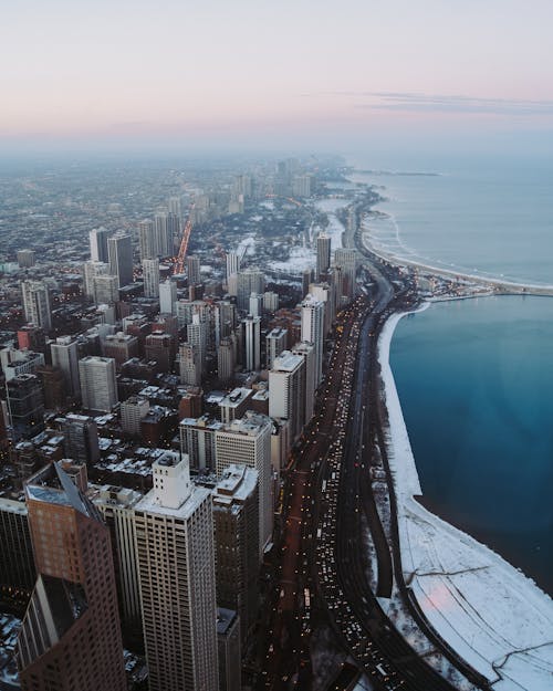 Aerial Photography Of Buildings Beside Seashore