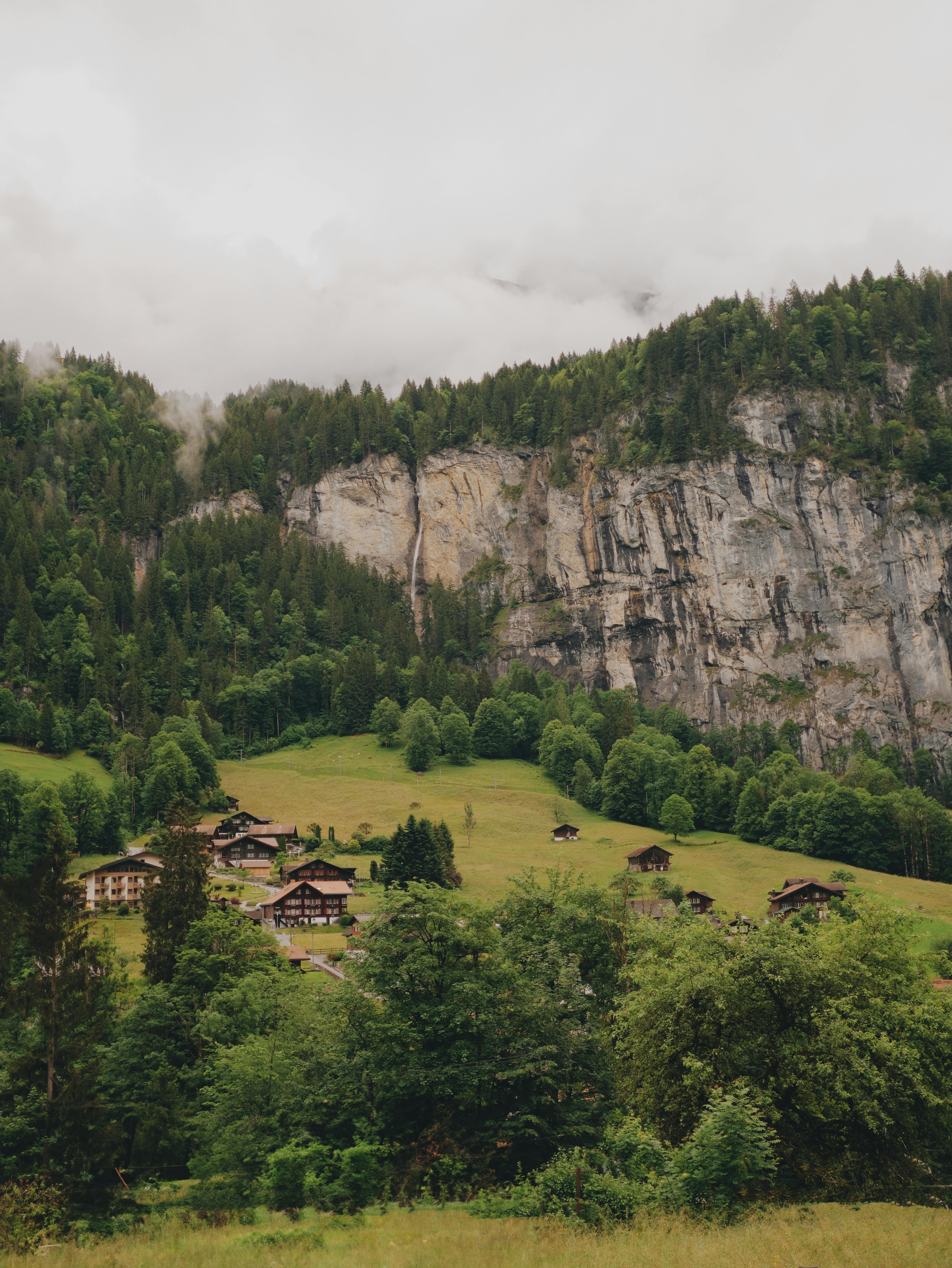 a mountain with a small village in the background