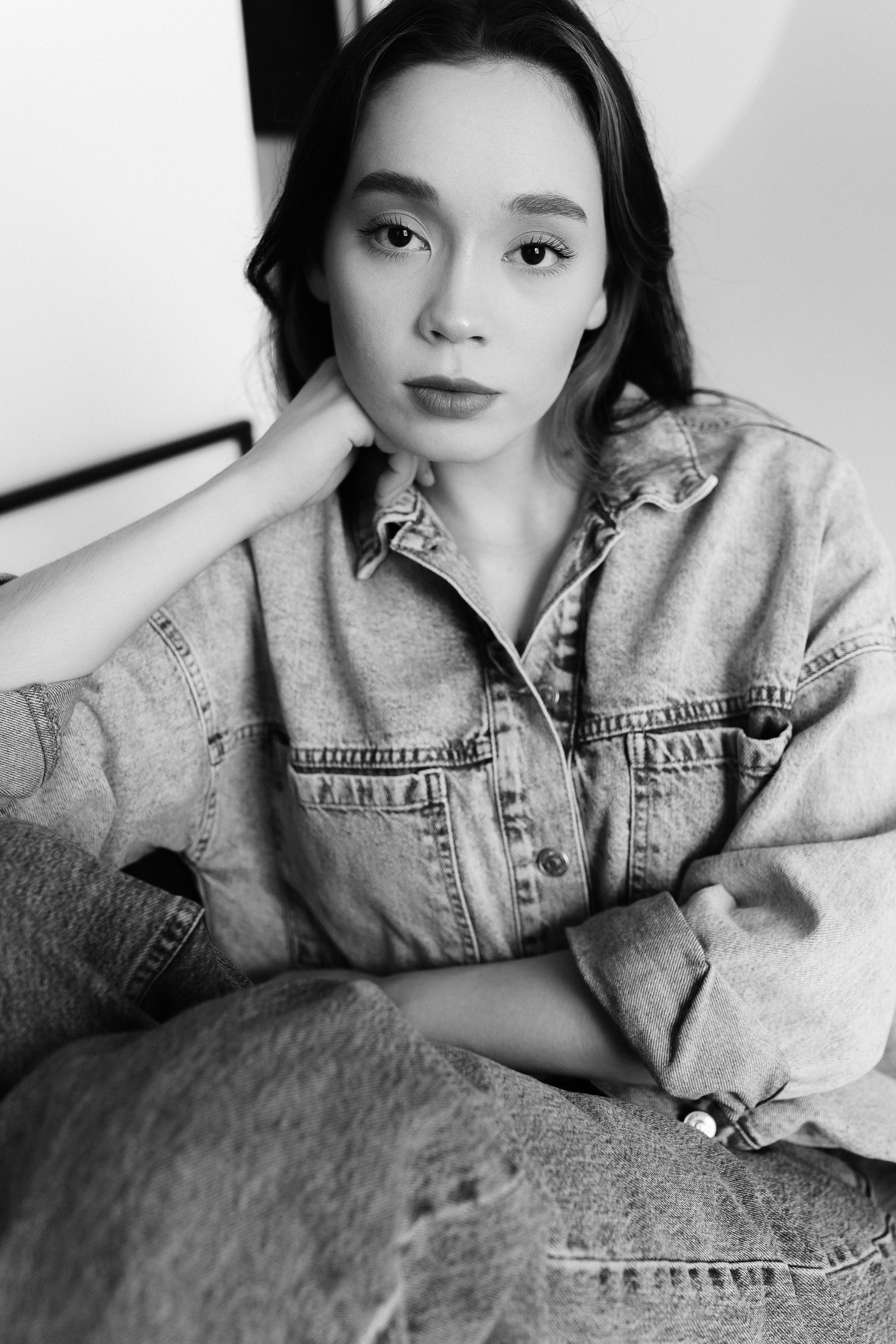 A woman in denim jacket sitting on a chair · Free Stock Photo
