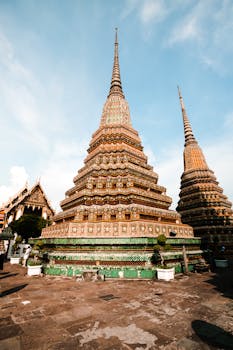 Stunning view of a richly adorned pagoda at Wat Pho temple complex in Bangkok, Thailand.