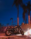 Photo of Black Motorcycle Parking Near Cinder Blocks at Night