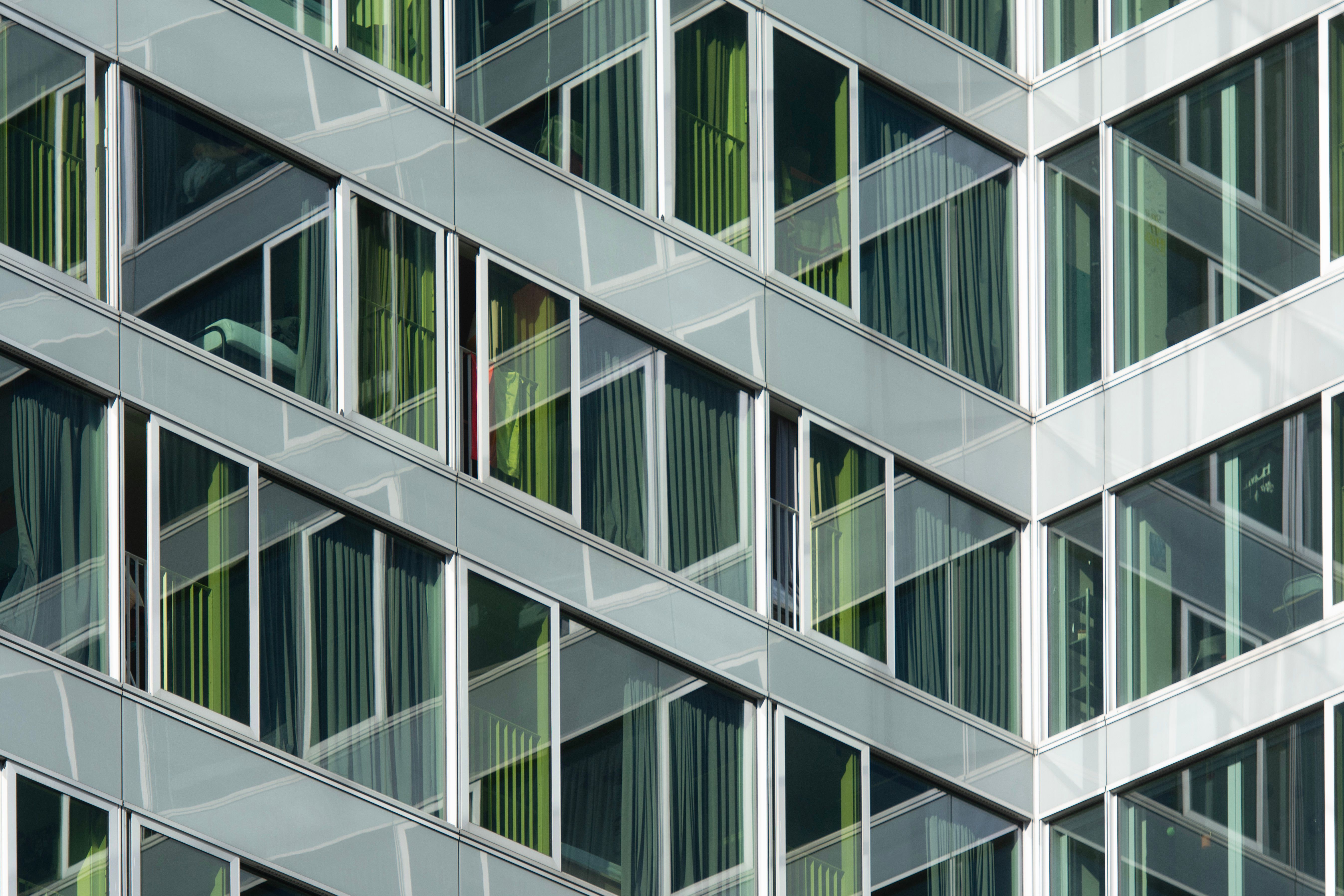 A close up of a building with many windows · Free Stock Photo