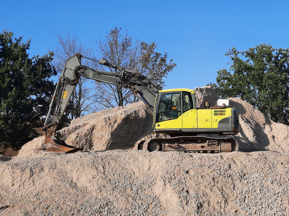 DX-PC400 Excavator, yellow-green excavator on a gravel mound