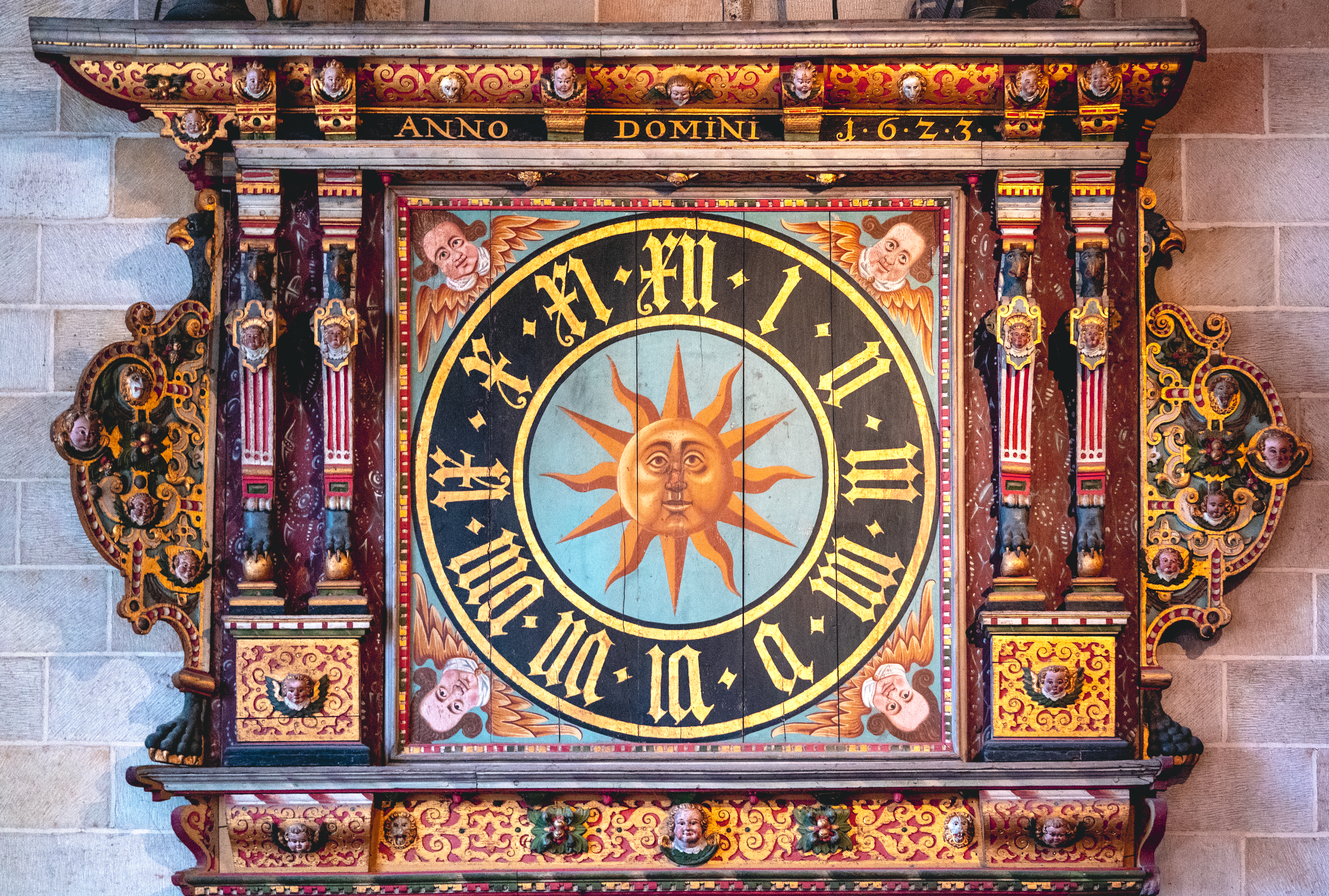 A clock with a sun on it · Free Stock Photo