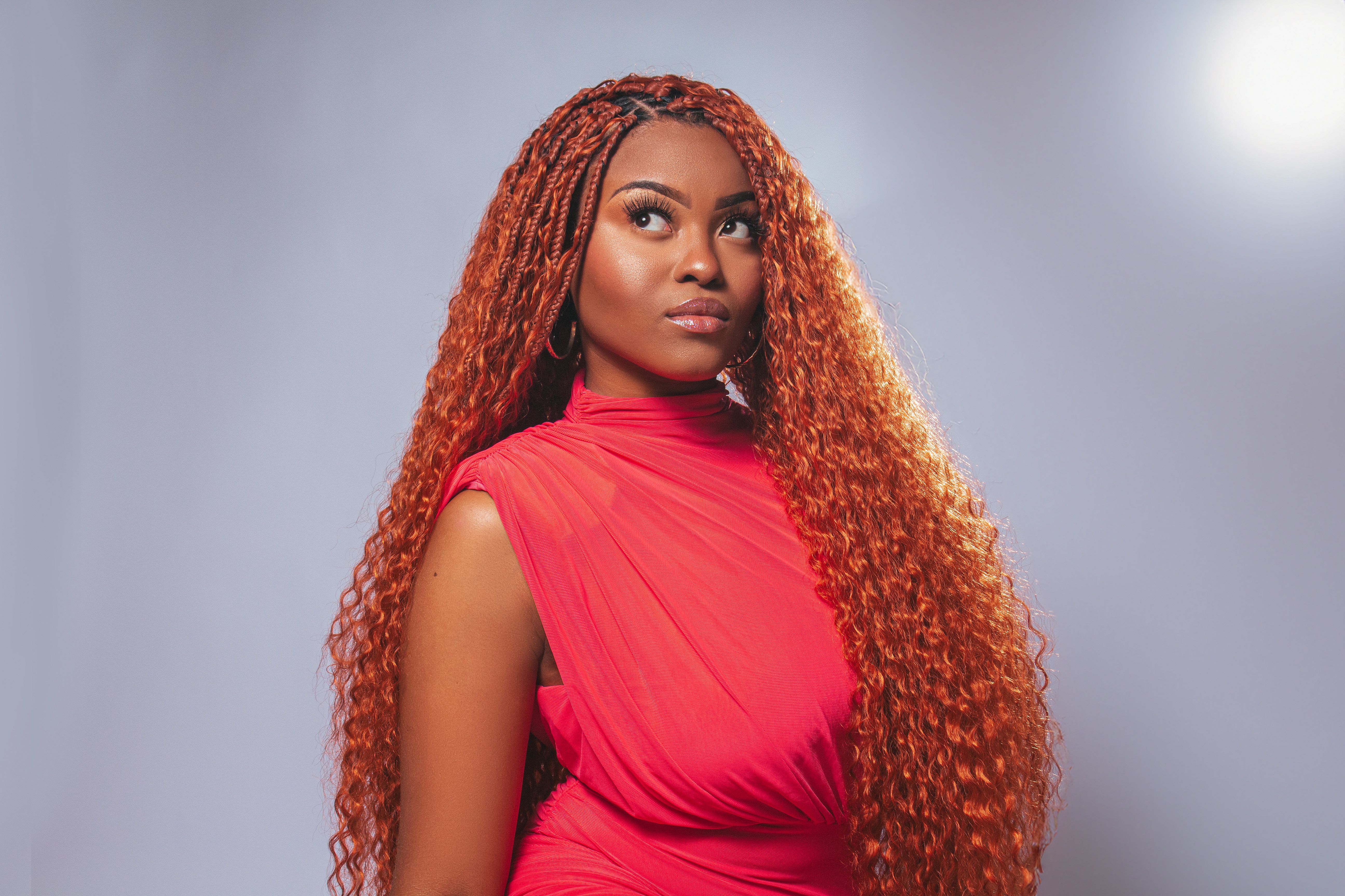 A woman with long red hair posing for a photo · Free Stock Photo