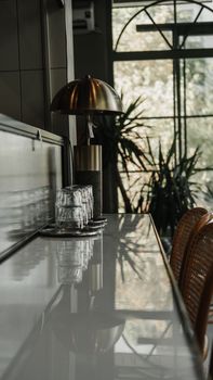 Stylish café interior in Ankara with elegant furnishings and warm sunlight pouring through large windows.