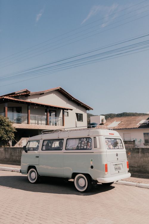 Free A classic van parked on a suburban street under a clear sky, evoking travel and nostalgia. Stock Photo