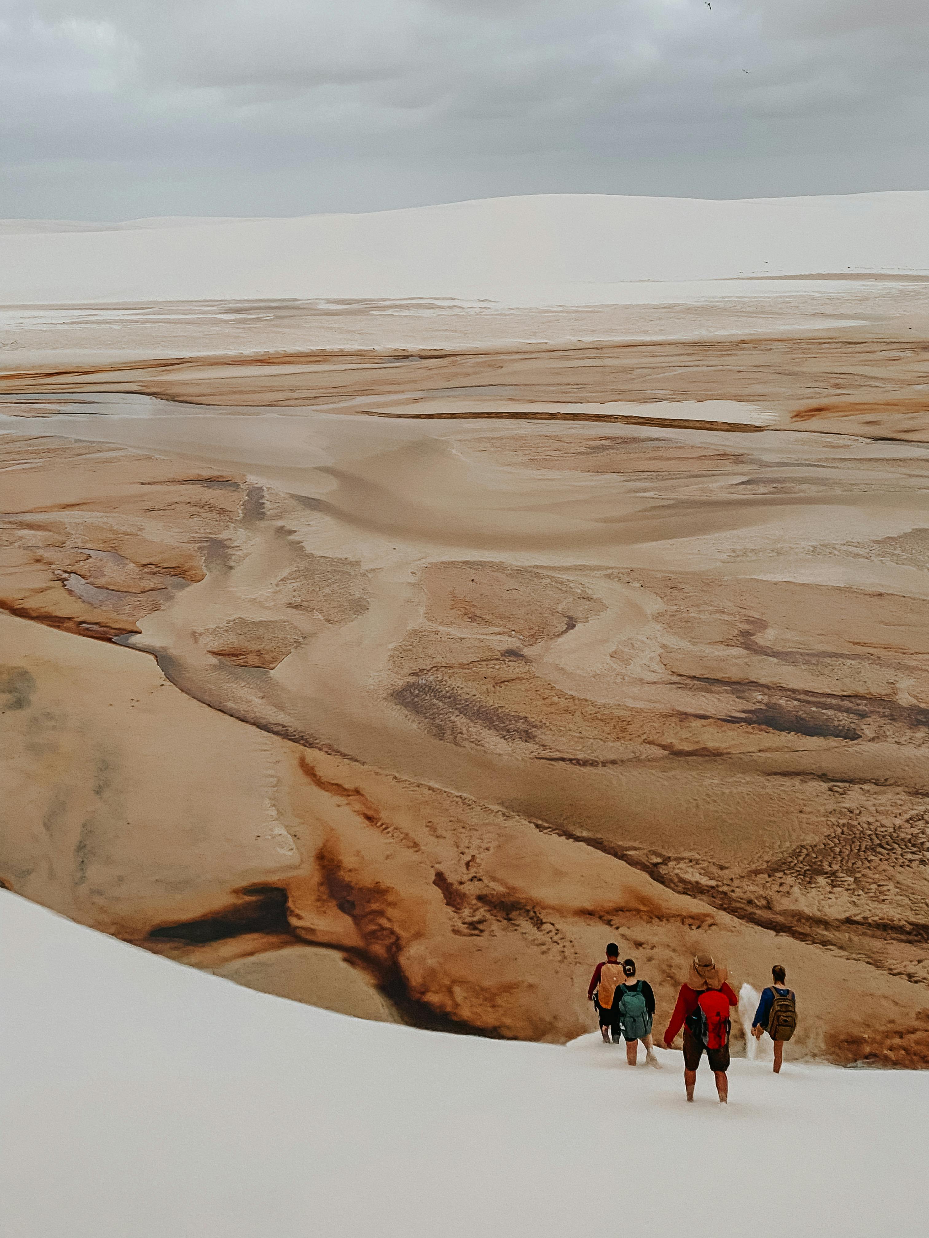 people hiking at desert