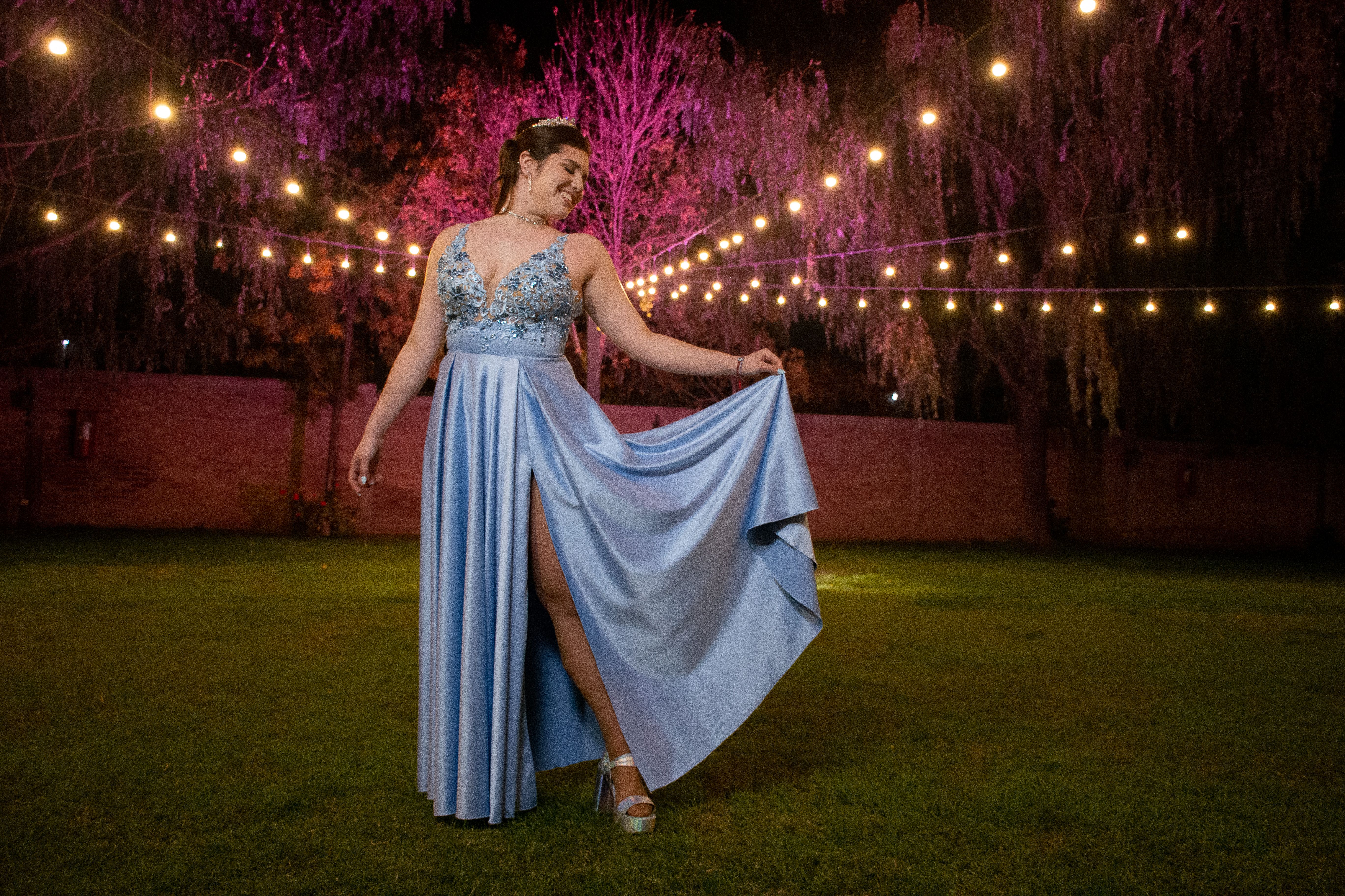 A woman in a blue dress standing in the grass · Free Stock Photo
