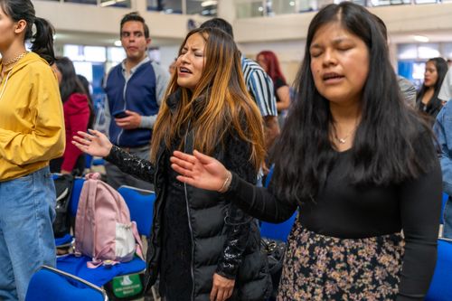 Free Women participate in a vibrant worship session in Mexico City, capturing faith and community. Stock Photo
