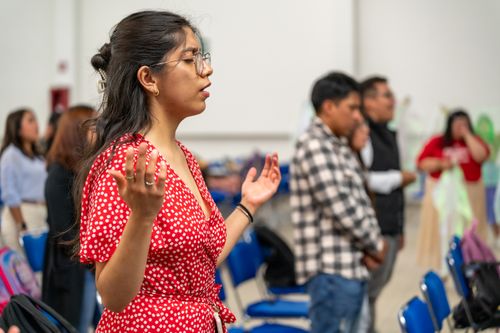 Free A woman engaged in prayer during a worship service in Ciudad de México. Stock Photo