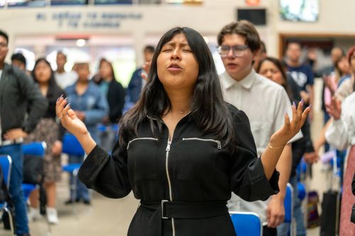Free A group of people engaged in prayer and worship inside a church in Ciudad de México. Stock Photo