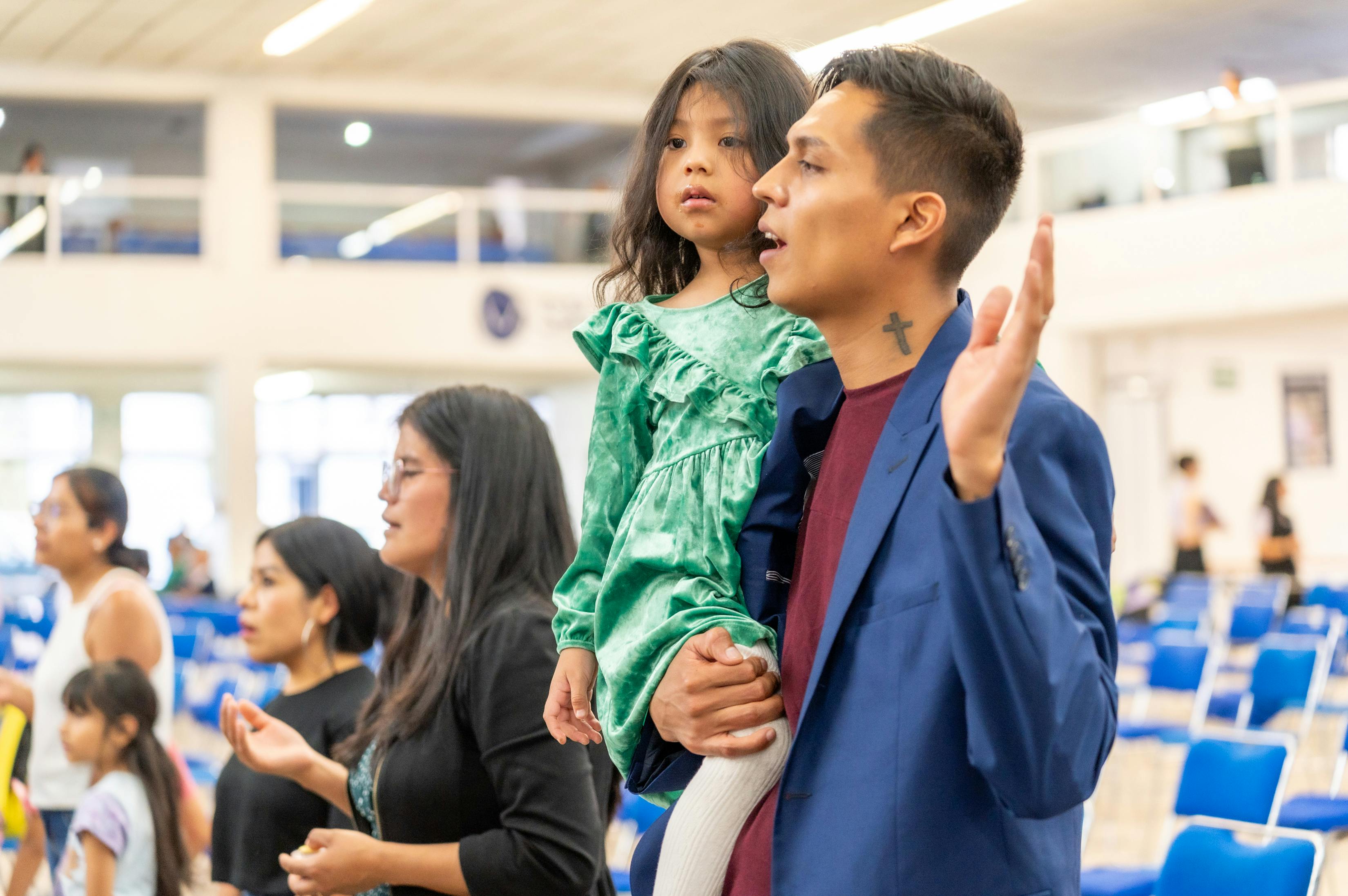 Parent Singing To A Toddler In A Public Place