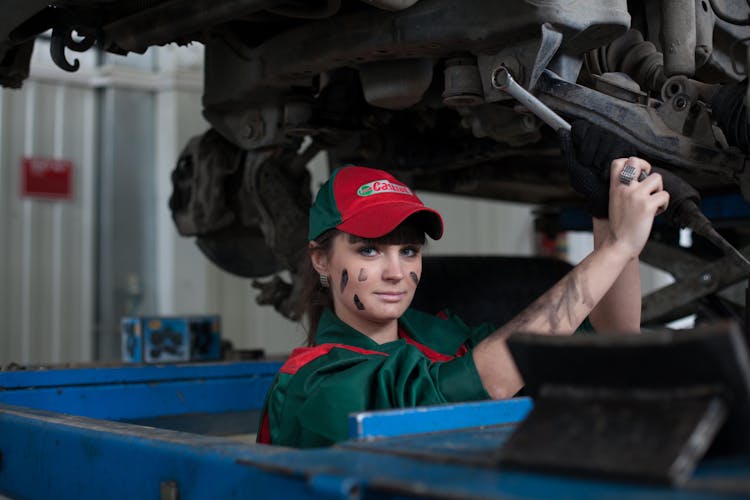 Woman Holding Gray Steel Wrench