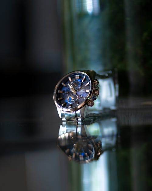 Selective Focus Photography Of Round Silver Chronograph Watch 