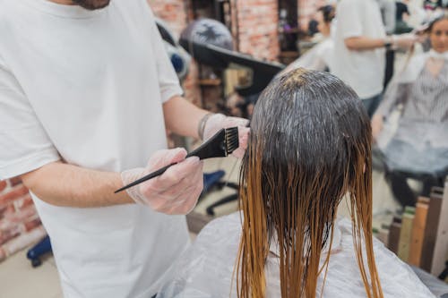 Person Holding Black Brush