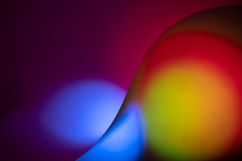 Dynamic abstract design with vibrant gradient color waves creating a futuristic feel.
