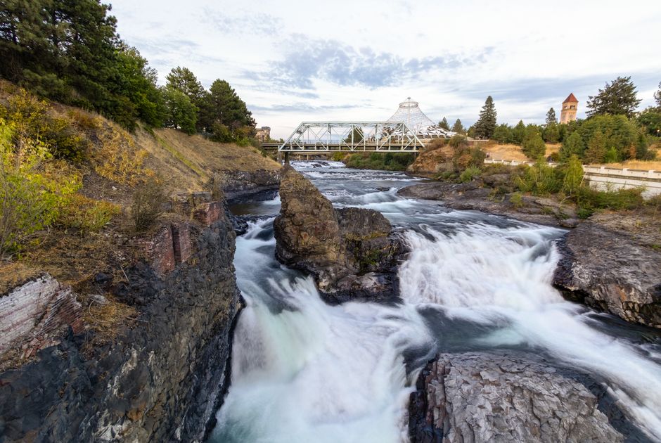 Scenic view of waterfalls and bridge on Spokane River, Washington.