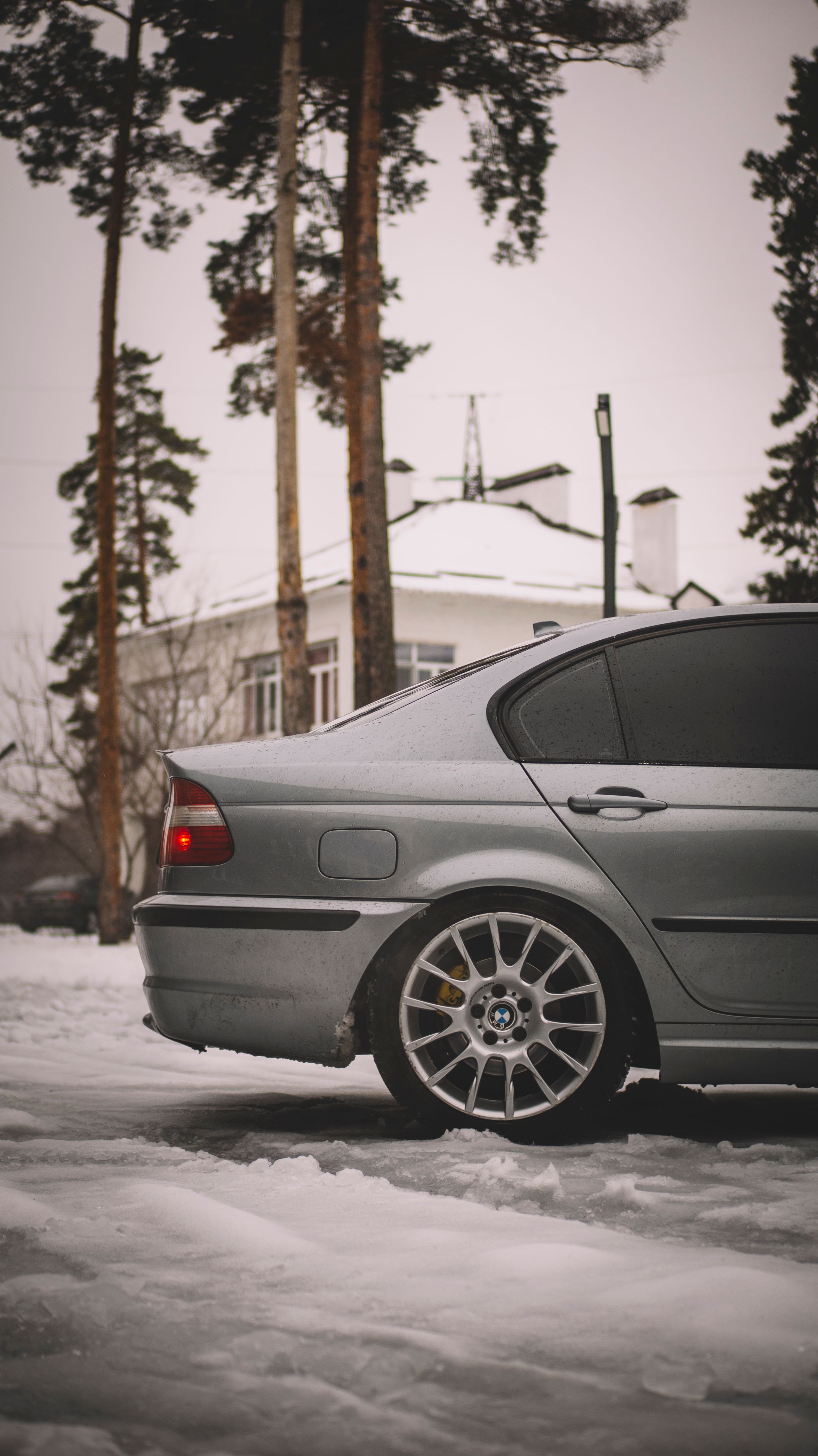 A silver car parked in the snow · Free Stock Photo