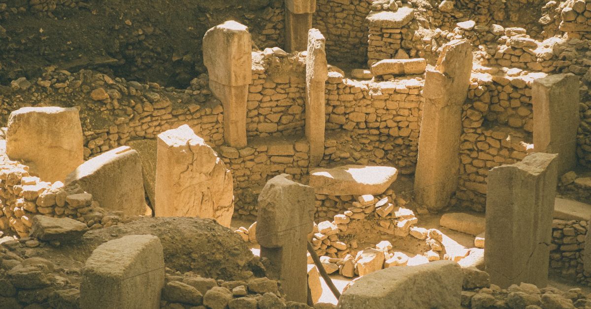 Multi Stone Building An ancient stone building with many stone pillars · Free Stock Photo