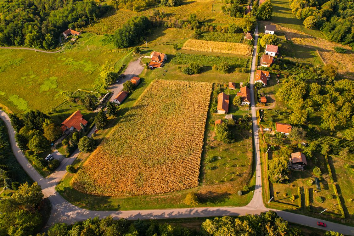 Panoramic Aerial View Rural Aerial view of a rural area with a farm and a field · Free Stock Photo