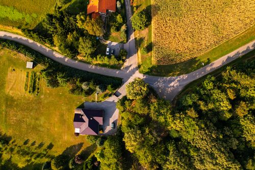 Free Stunning aerial photograph showcasing the rural landscape of Maglenča, Croatia, featuring lush greenery and winding roads. Stock Photo