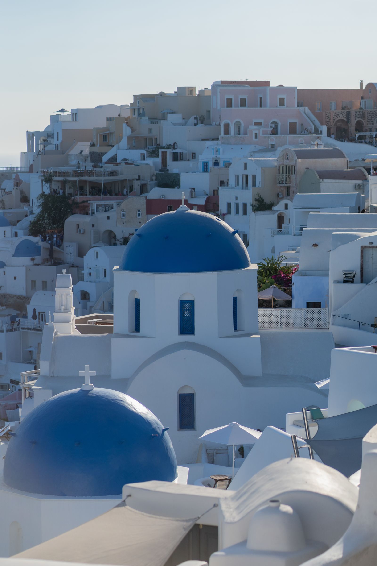 Santorini Oia blue dome sunset orange sky