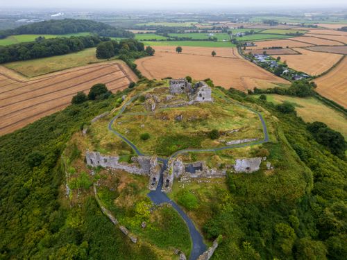 Free Aerial view of the historic Rock of Dunamase ruins surrounded by lush countryside in Ireland. Stock Photo