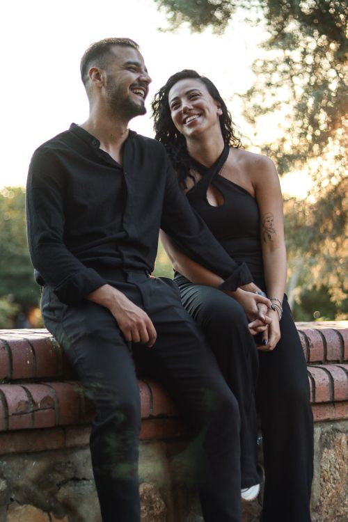 Free Captivating portrait of a couple enjoying a serene moment outdoors, showcasing affection and joy. Stock Photo